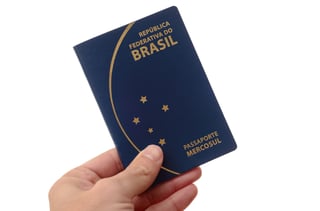Brazilian passport on yellow fabric background