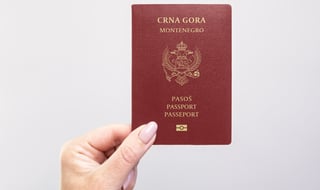 Close up of Montenegro passport in hand
