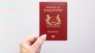 Close-up Singapore passport held in hand