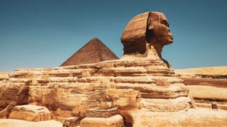 Great Sphinx with pyramid background