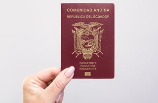 Hand holding Ecuador passport