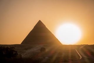 Pyramid silhouette with bright sunset