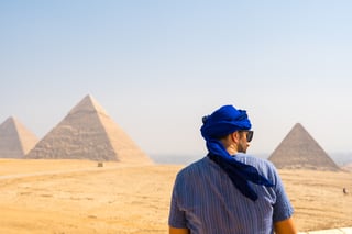 Tourist overlooking pyramids in Egypt