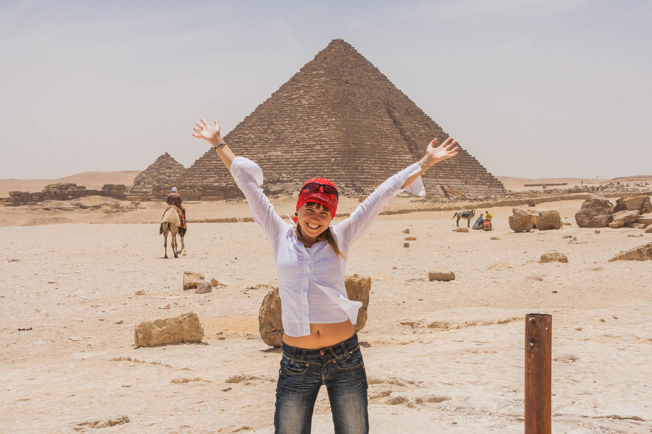 A Happy Tourist Posing In Front Of The Pyramid Of Giza Cairo A Happy Tourist Posing In Front Of The Pyramid Of Giza Cairo