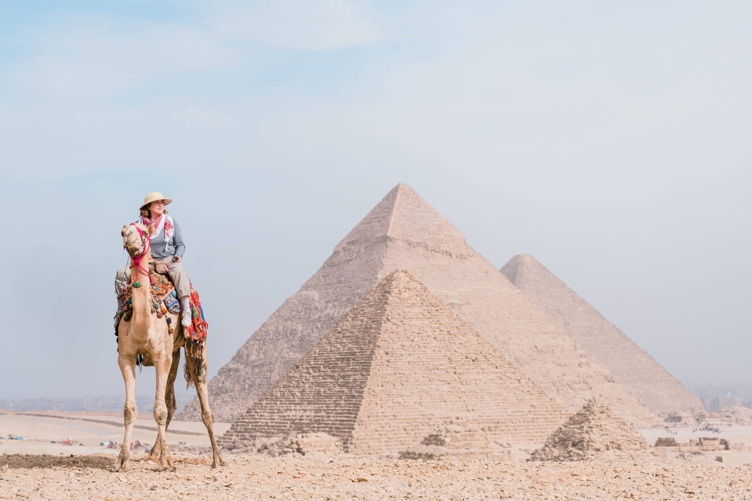 A Tourist In Front Of The Pyramids Of Giza A Tourist In Front Of The Pyramids Of Giza