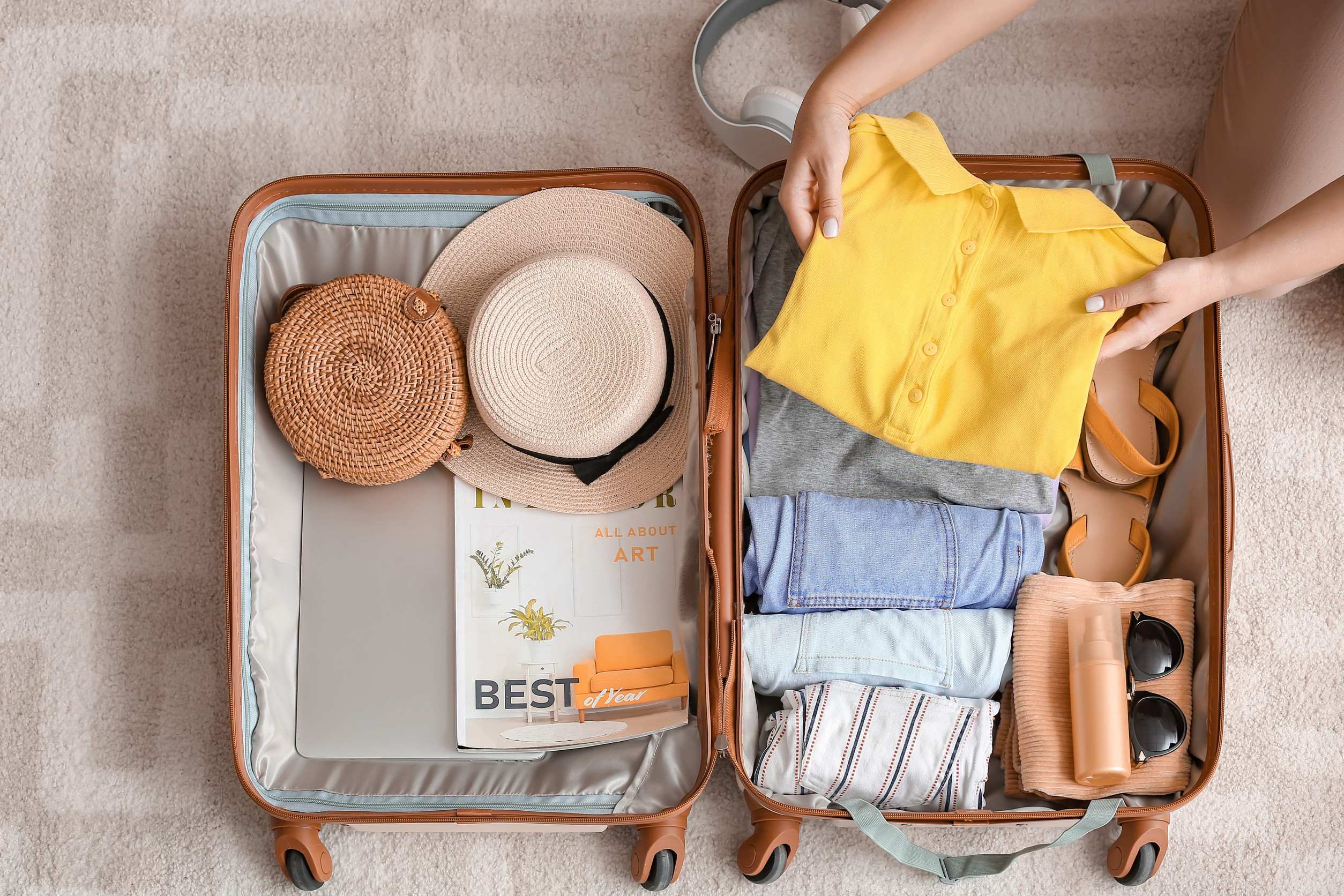 A Woman Packing A Suitcase A Woman Packing A Suitcase