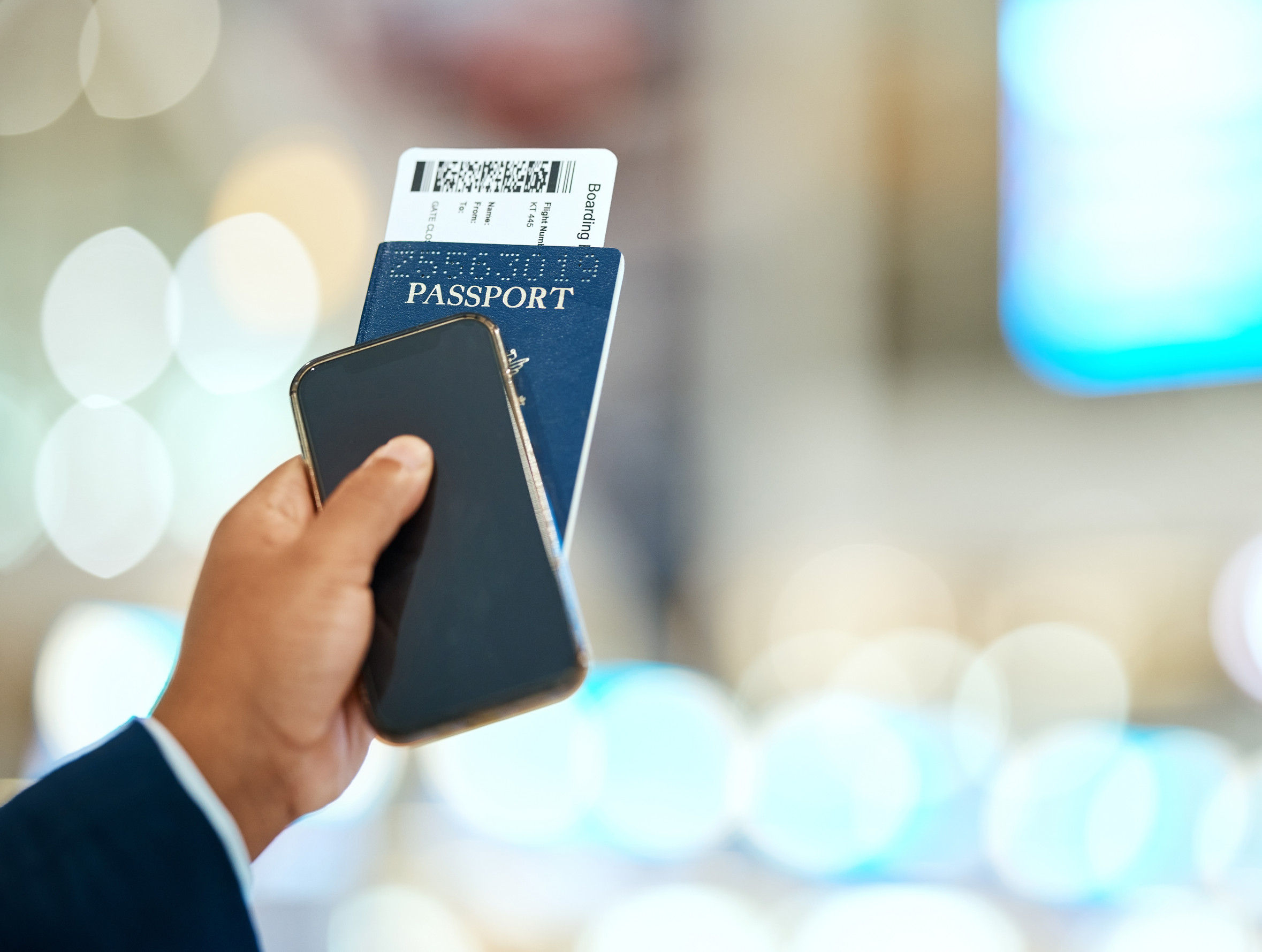 Airport Passport And Ticket In Hand With Phone For Online Booking Travel And Immigration