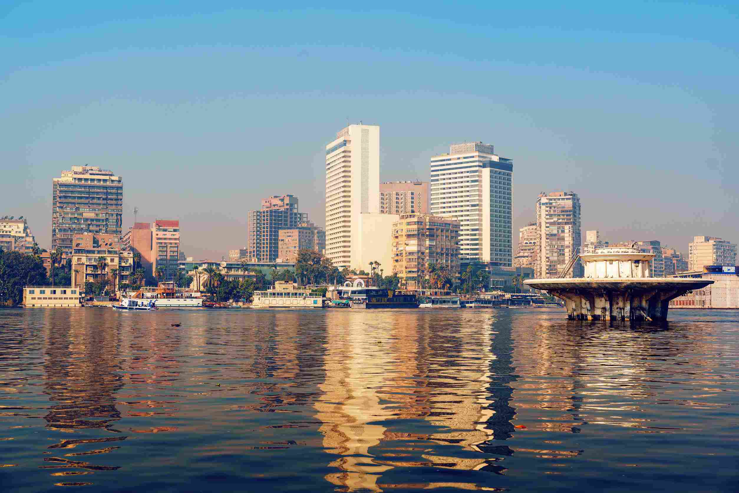 https egypt eta com images city skyline reflecting in the nile river at sunset in cairo