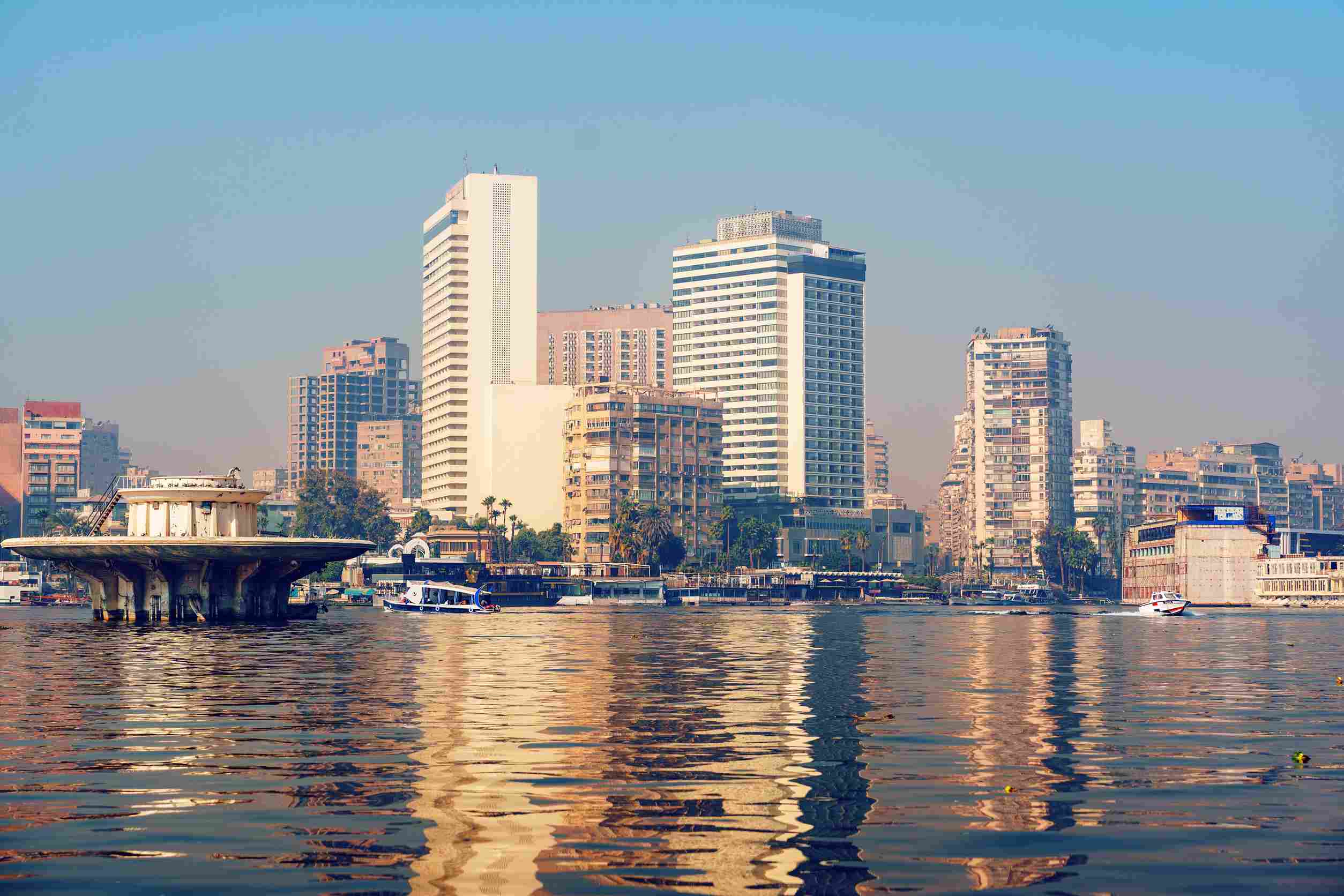 https egypt eta com images city skyline reflection on the nile river with modern buildings in cairo during a clear