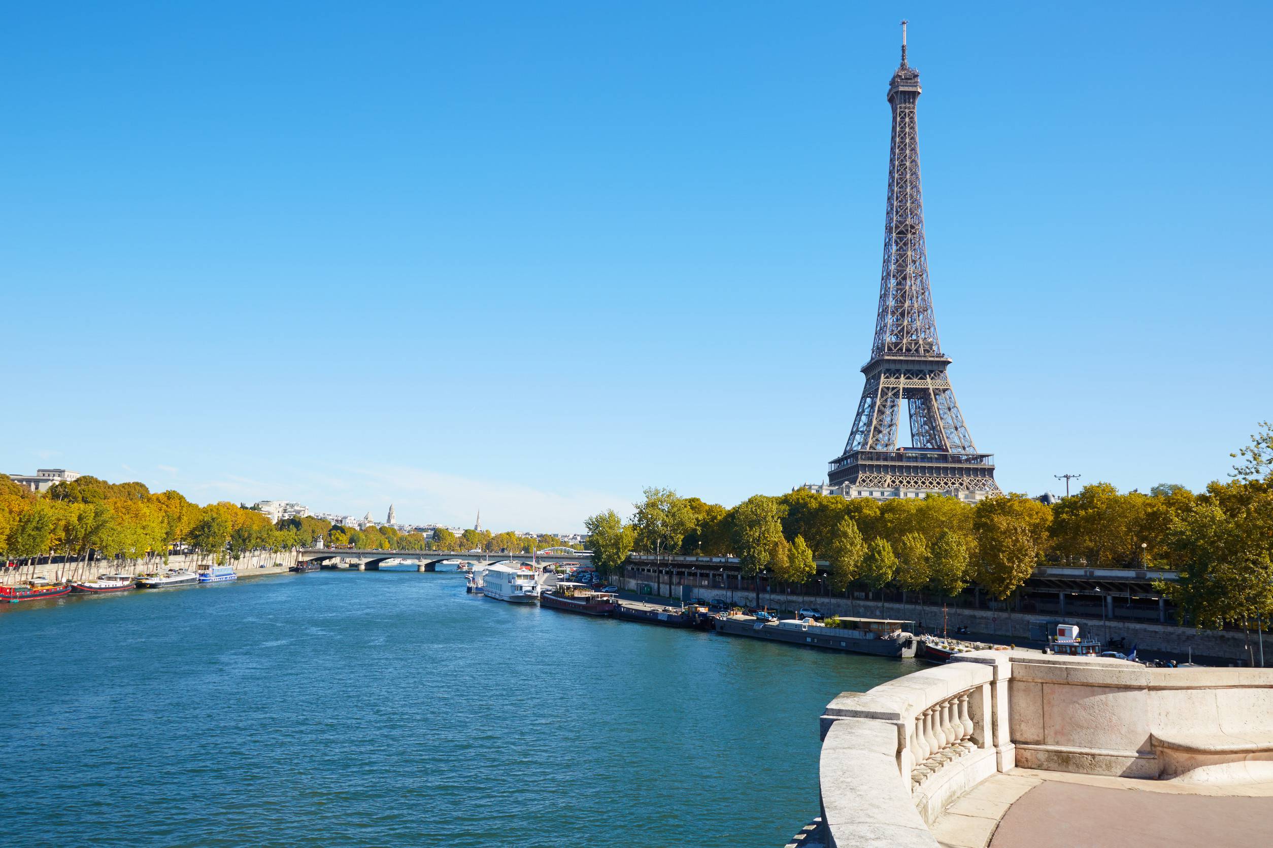 https egypt eta com images eiffel tower and empty white balcony on seine river in a clear sunny day autumn in paris