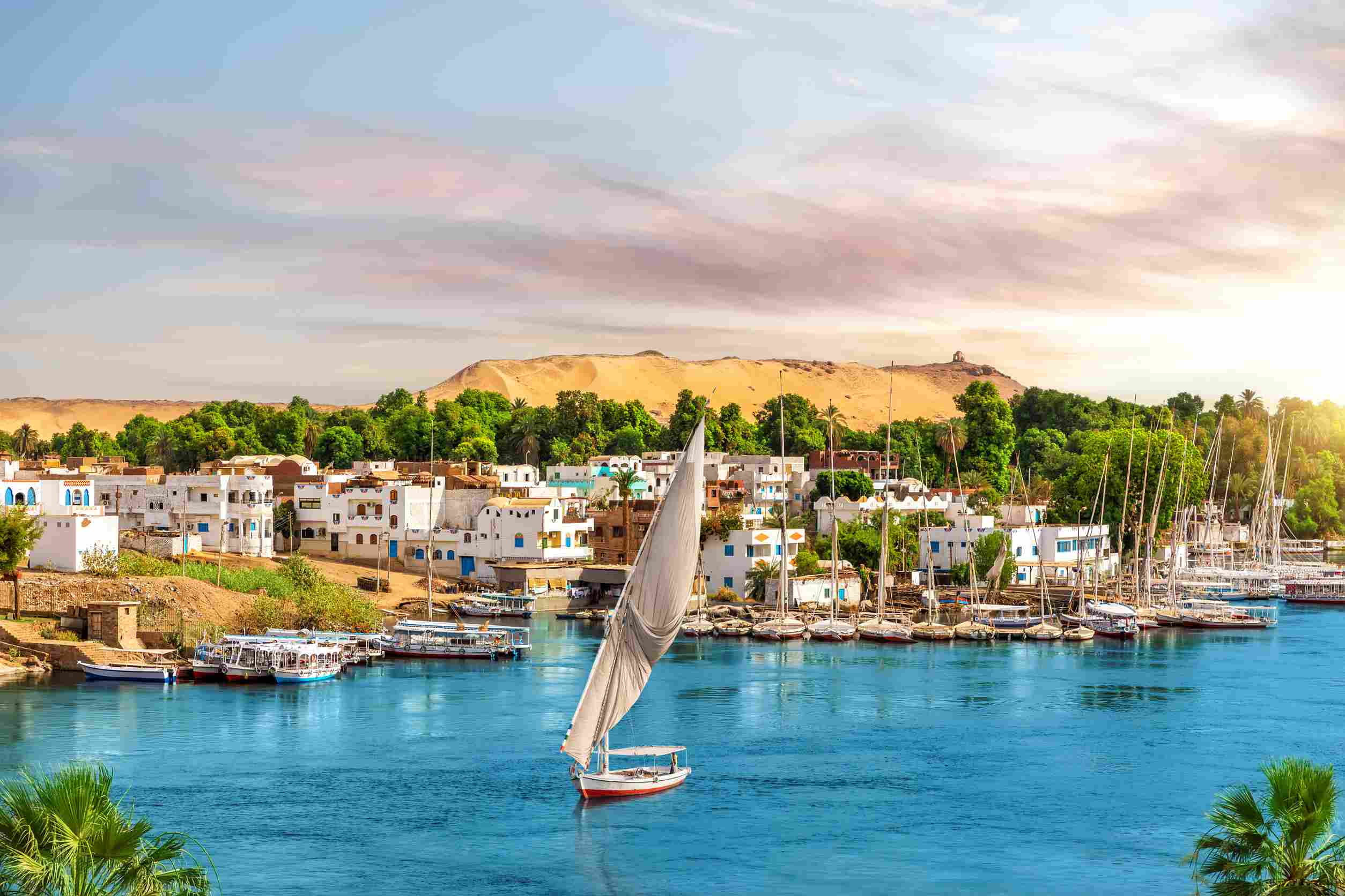 https egypt eta com images picturesque buildings of aswan the nile and sailboats egyp