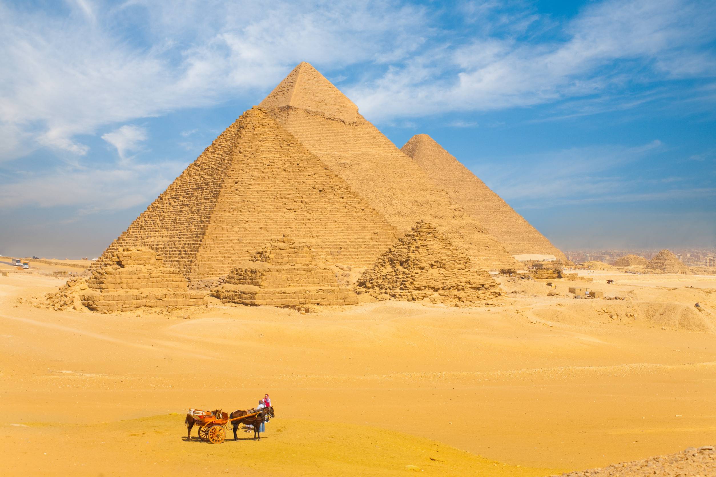 https egypt eta com images the giza pyramids lined up in a row against a beautiful blue sky in cairo egypt