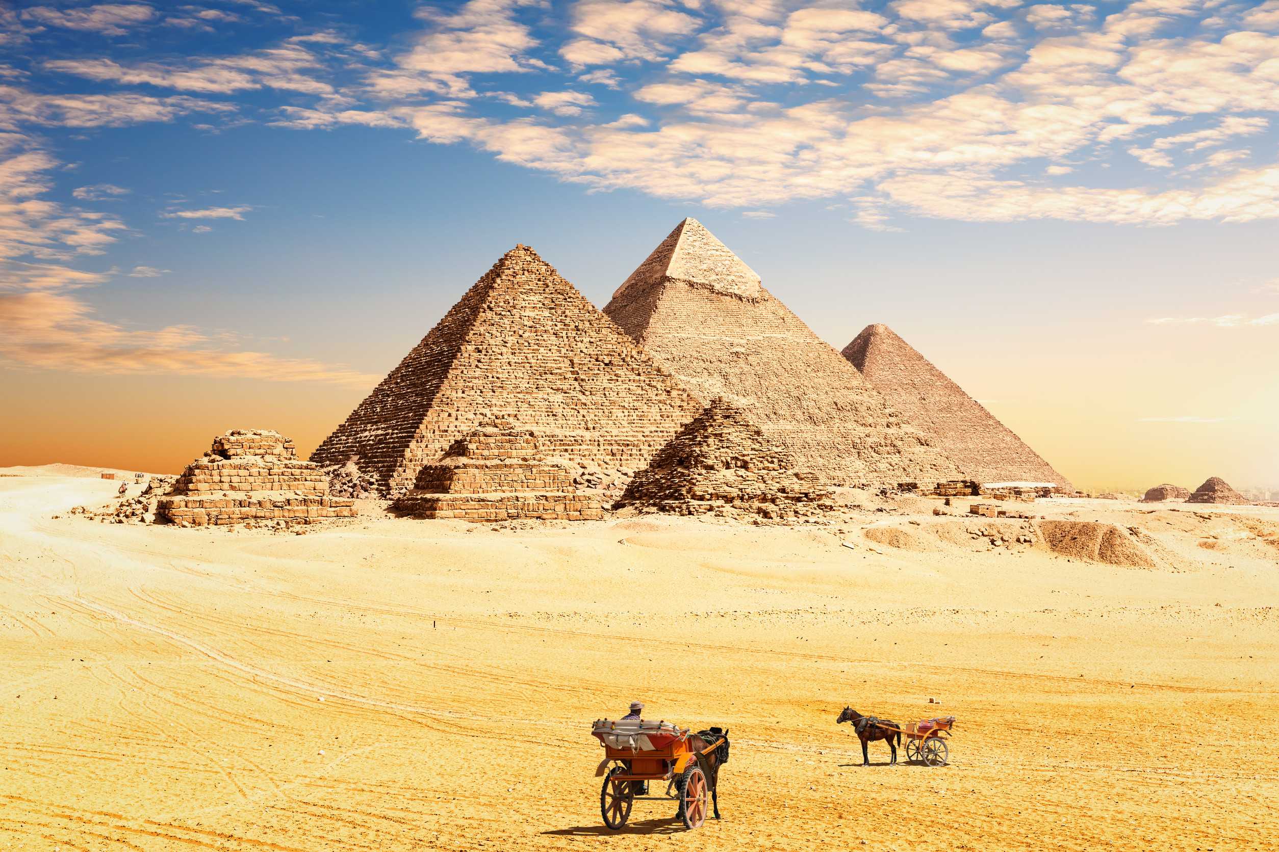 The Great Pyramids Of Egypt And Traditional Desert Carriages Cairo Giza