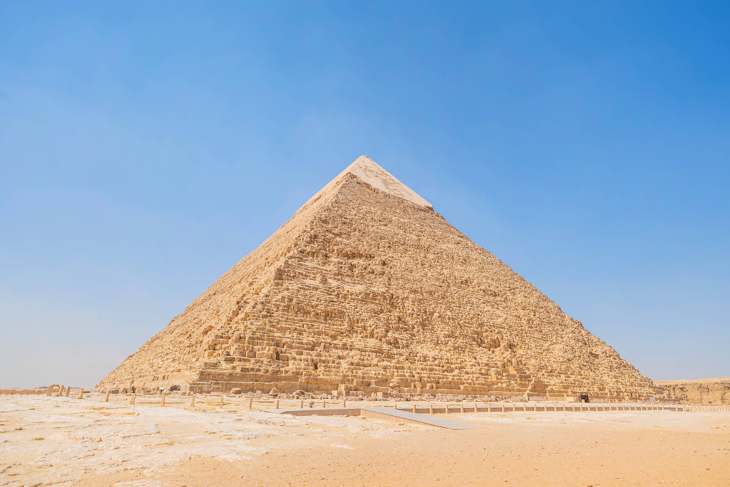 https egypt eta com images the high pyramid of chephren on the background of a blue sky with clouds giza