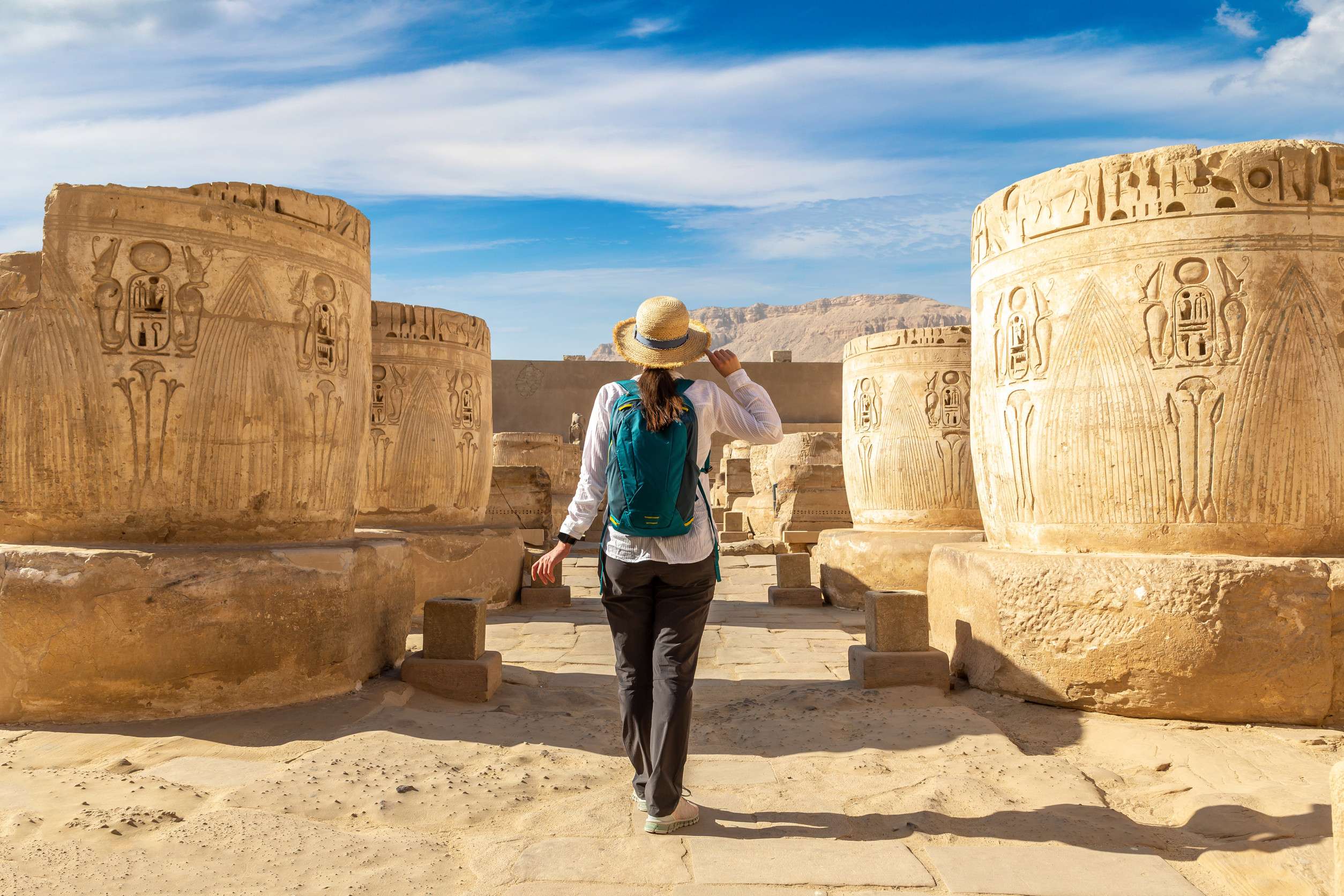 Tourist exploring ancient Egyptian temple ruins