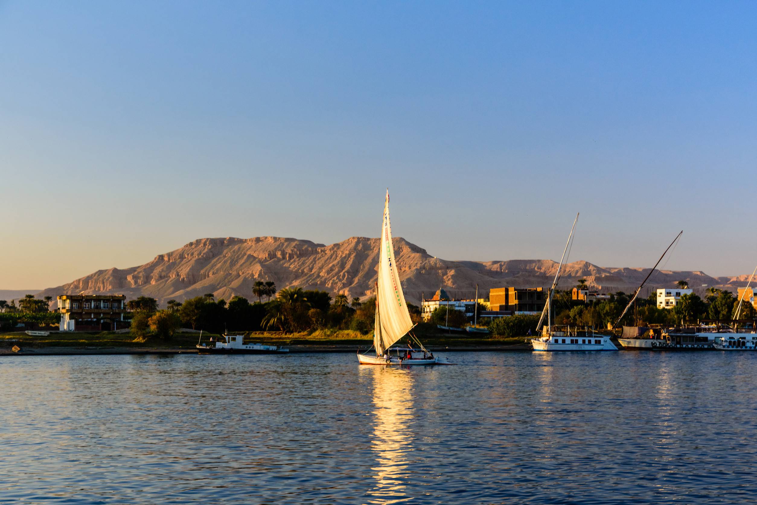 https egypt eta com images traditional egyptian vessel felucca on nile river in luxor egyp