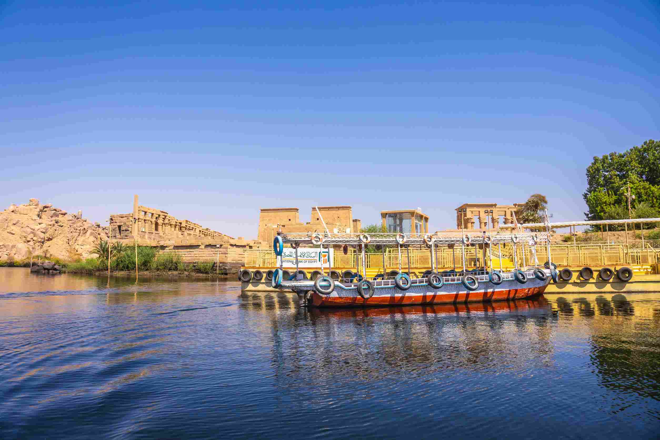 https egypt eta com images traditional transport boats to the temple of philae a greco roman construction seen from