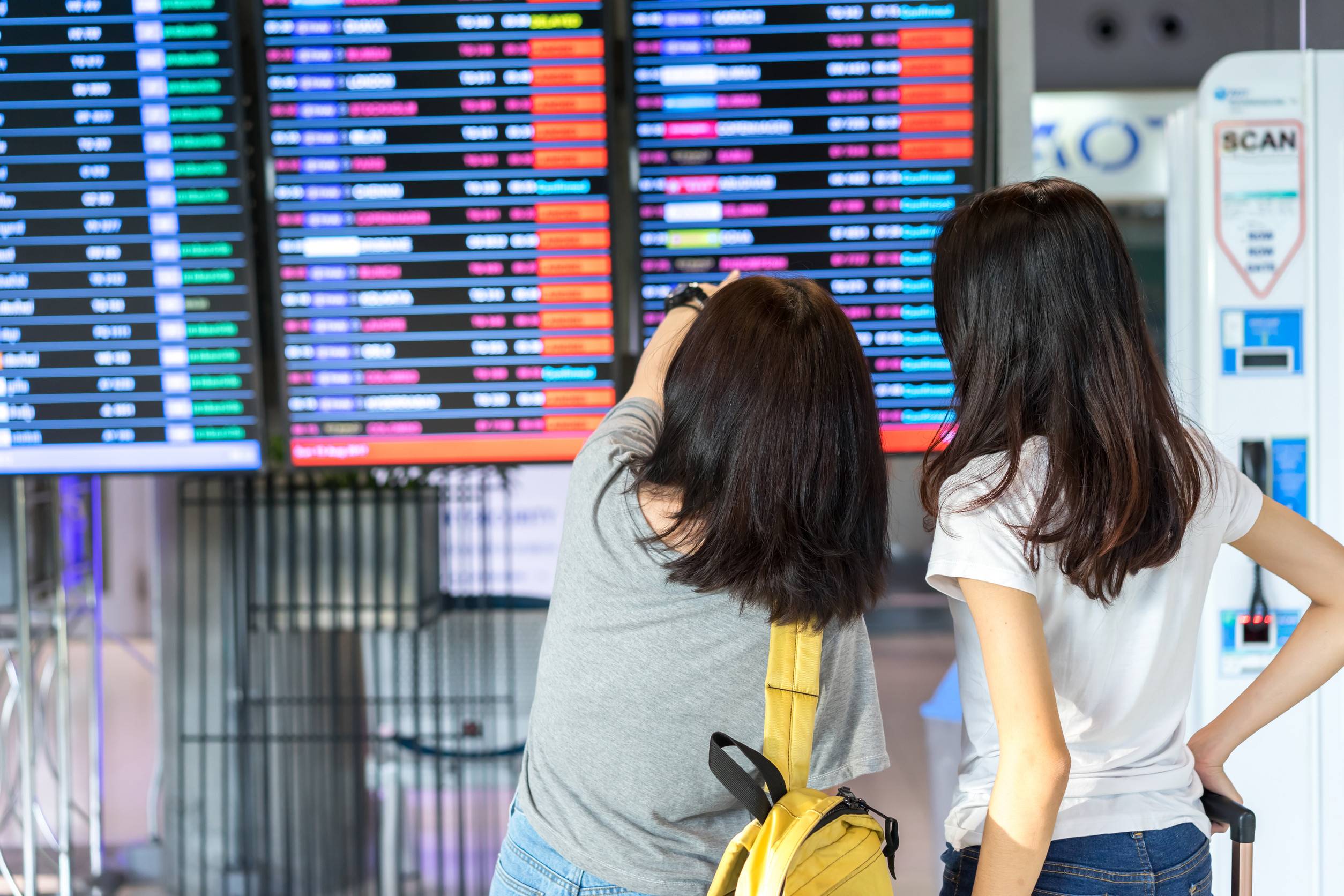 Young Girl Asian Together Traveler Looking Timetable With Carrying Suitcase Luggage And Passenger